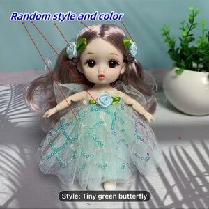 Charming Doll with Green Dress and Floral Accents